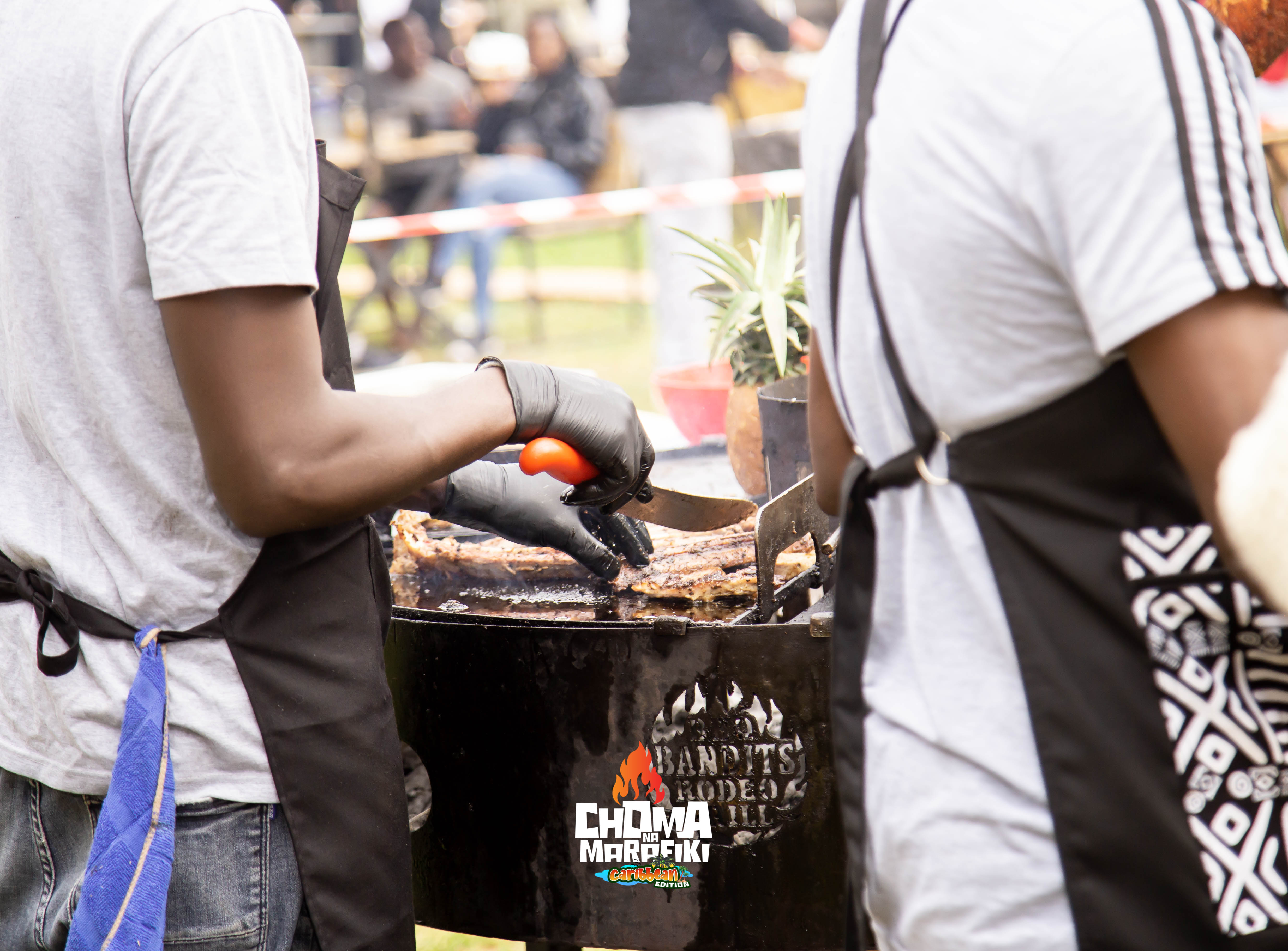 Choma Na Marafiki team grilling on drum BBQ at Caribbean Edition