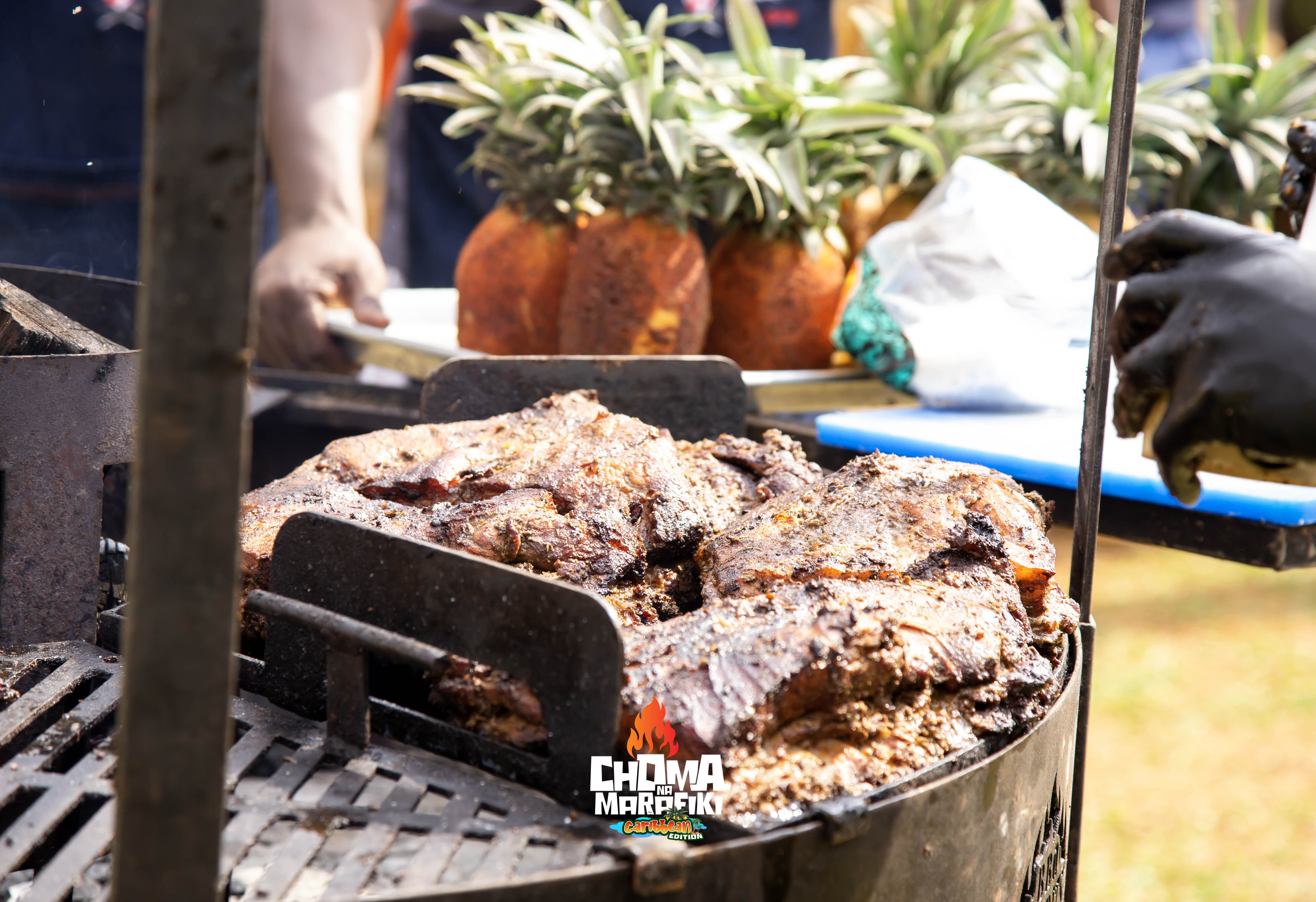 Kelly's BBQ Sunday jerk chicken served on pineapple board at Caribbean Edition
