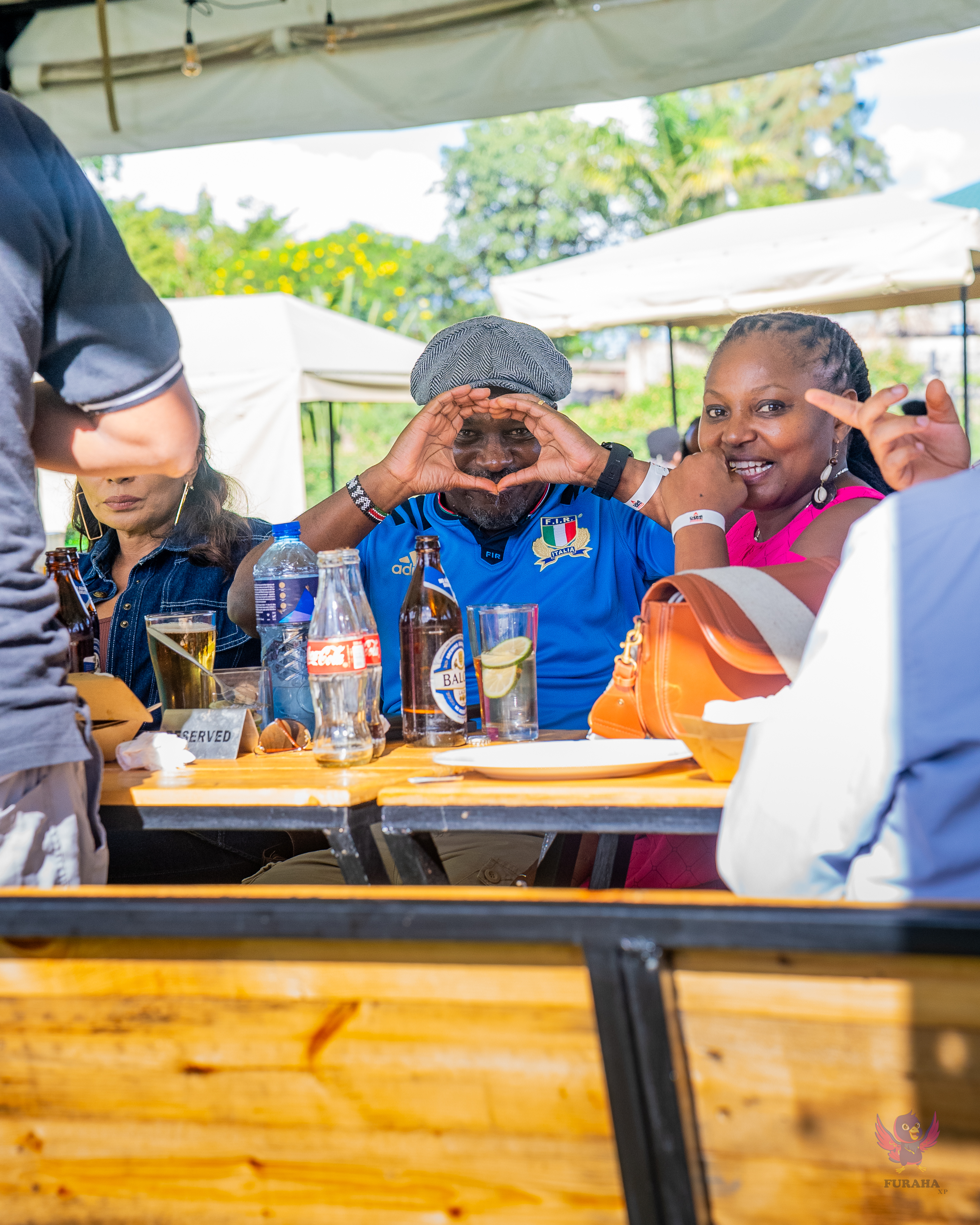 Happy guests enjoying BBQ at a Choma Na Marafiki event